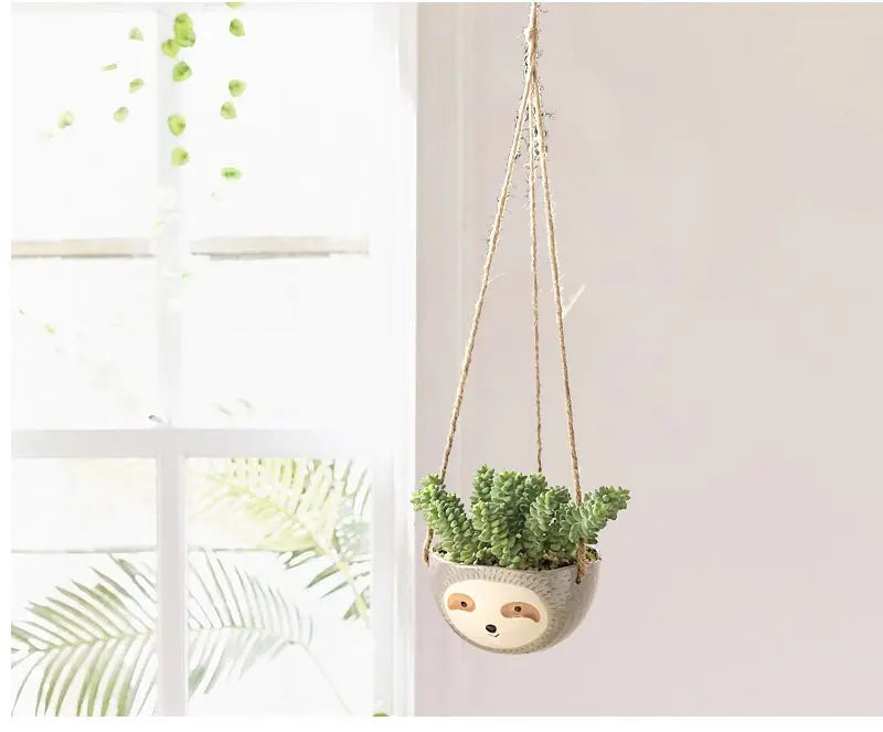 Jarrón con forma de perezoso para plantas colgantes