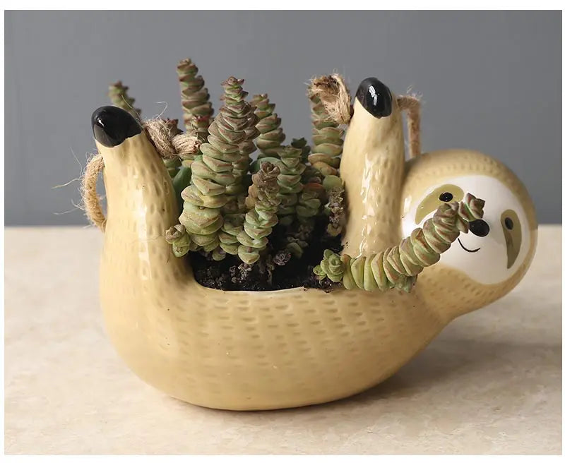 Jarrón con forma de perezoso para plantas colgantes